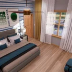 Primary bedroom in cottage house with ensuite bathroom, natural light, modern decor, wooden flooring, and cozy seating